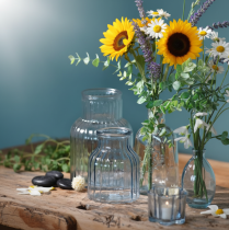 Artikel Bloemenvaasjes glas groeven design blauw Ø11cm H14.5cm 2 stuks