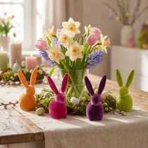 Artikel Kleine zittende paashaasjes, kleurrijk gevlokt, 13 cm, 8 stuks