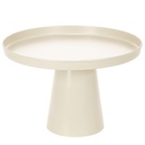 Artikel Ronde decoratieve schaal in crèmekleur, 30 cm, op een standaard voor tafeldecoratie.
