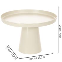 Artikel Ronde decoratieve schaal in crèmekleur, 30 cm, op een standaard voor tafeldecoratie.