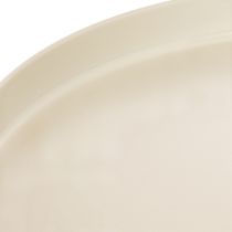Artikel Ronde decoratieve schaal in crèmekleur, 30 cm, op een standaard voor tafeldecoratie.