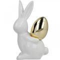 Floristik24 Konijnen met gouden ei, keramische konijnen voor Pasen nobel wit, gouden H13cm 2st