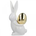 Floristik24 Elegante paashazen, keramische konijntjes met gouden ei, paasdecoratie wit, gouden H18cm 2st